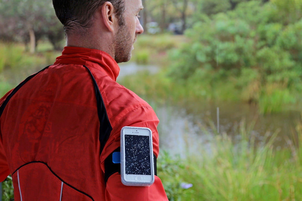 A runner wearing the Quad Lock armband and case for iPhone 7 plus/8 Plus for extra protection